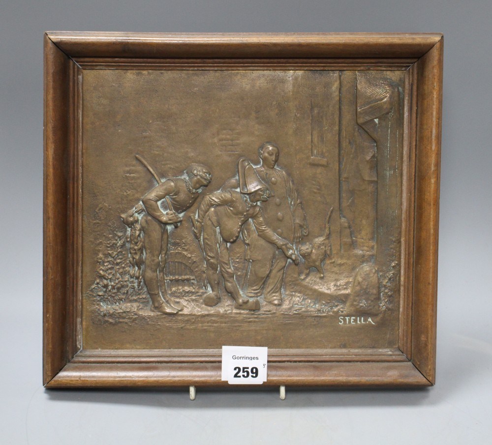 An early 20th century bronze plaque, cast in relief with Punchinello and signed Stella, 26 x 29cm, overall 32 x 36cm